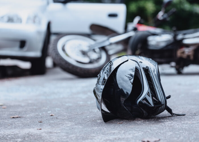 Black biker helmet on street